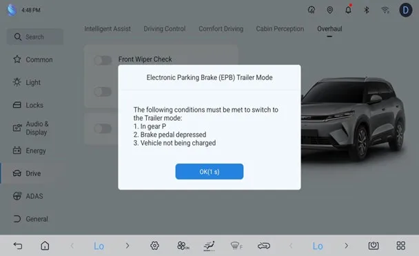 Settings screen, Drive section, Overhaul tab, with a dialog titled ‘Electronic Parking Brake (EPB) Trailer Mode’ listing the conditions to switch to trailer mode: in gear P, brake pedal depressed, vehicle not being charged, with an OK button.