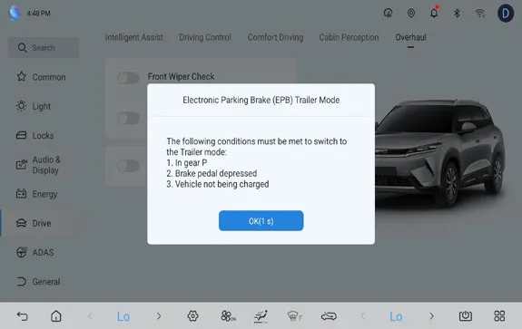 Head-unit Settings > Drive > Overhaul page with a dialog titled ‘Electronic Parking Brake (EPB) Trailer Mode’ listing the conditions to switch to trailer mode: 1. In gear P, 2. Brake pedal depressed, 3. Vehicle not being charged, with an OK button.
