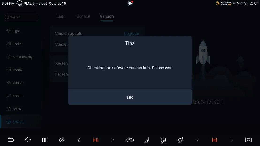 Head-unit settings, System section, Version tab, with a Version update row and an Upgrade link, and a Tips dialogue reading Checking the software version info. Please wait with an OK button.